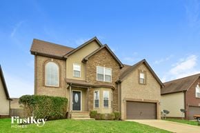 Clarksville house for rent - a large brick house with a blue sky in the background