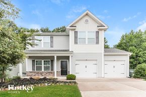 Gastonia house for rent - a white house with white shutters and a driveway