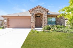 Fort Worth house for rent - a house with a driveway and a garage door