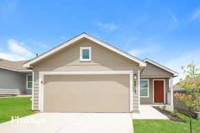 San Antonio house for rent - a tan house with a garage door
