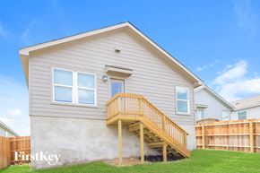 San Antonio house for rent - the exterior of a house with a porch and a staircase