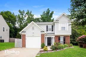 Charlotte house for rent - A two-story house with a garage is for sale.