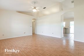 Englewood house for rent - an empty living room with white walls and wood floors