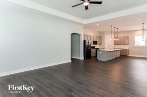 Summerville house for rent - A spacious kitchen area with a ceiling fan and pendant lights.