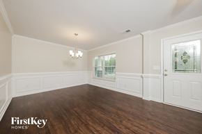 Lexington house for rent - the living room of a home with white walls and wood floors