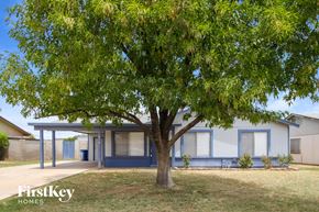 Tempe house for rent - a house with a tree in front of it