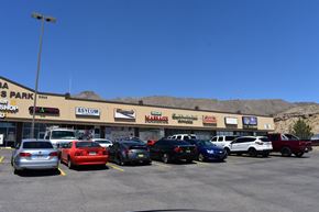 El Paso apartment for rent - a parking lot full of cars in front of a shopping center