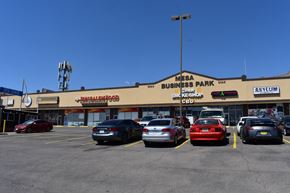 El Paso apartment for rent - a parking lot filled with cars in front of a shopping mall