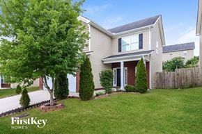Antioch house for rent - a house with a lawn and a tree in front of it