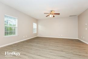 Antioch house for rent - a clean and empty living room with a ceiling fan