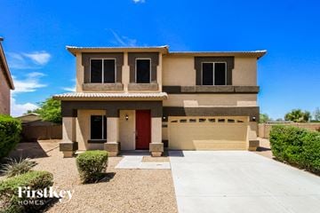 San Tan Valley house for rent - a house with a driveway and a garage door in front of it