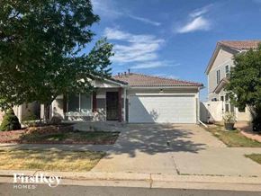 Denver house for rent - a house with a driveway and a white garage door