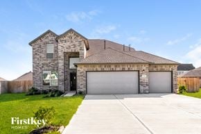 Mont Belvieu house for rent - a large house with a garage door in front of it