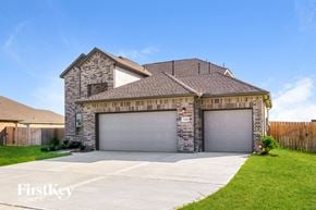 Mont Belvieu house for rent - a house with two garages and a driveway in front of it
