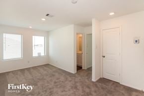 Mont Belvieu house for rent - a bedroom with a closet and a door to a bathroom