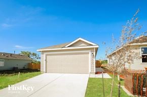 San Antonio house for rent - a home with a garage door and a driveway