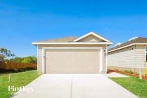 San Antonio house for rent - a home with a garage door and a driveway