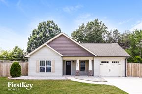 Kernersville house for rent - A house with a brown roof and a white garage door is for sale.