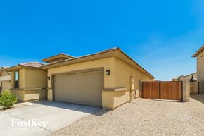 Surprise house for rent - a house with a driveway and a garage door