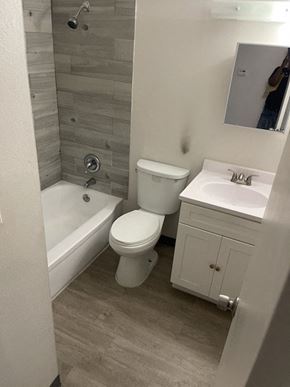Jennings apartment for rent - a bathroom with a toilet and a tub and a sink
