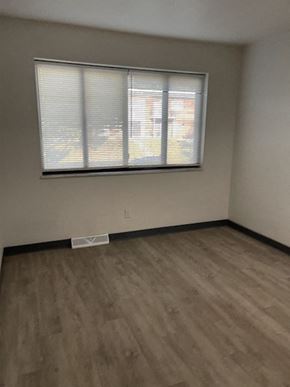 Jennings apartment for rent - an empty room with a window and wooden floors