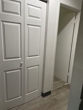 Jennings apartment for rent - a white door in a room with a staircase