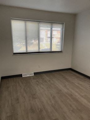 Jennings apartment for rent - an empty room with a window and wooden floors