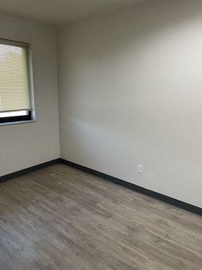 Jennings apartment for rent - an empty room with a window and wooden floors