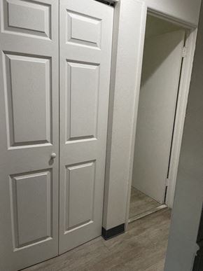 Jennings apartment for rent - a white door in a room with a staircase