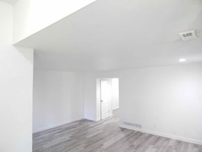 Jennings apartment for rent - a living room with white walls and wood floors