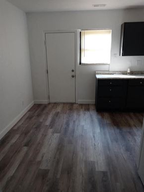Jennings apartment for rent - a room with wooden floors and a sink and a door