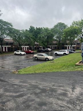 Jennings apartment for rent - a parking lot with cars parked in it