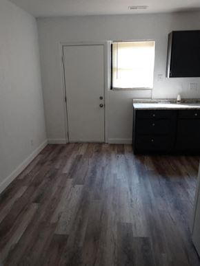 Jennings apartment for rent - a room with wooden floors and a sink and a door