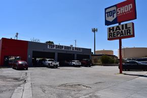 El Paso apartment for rent - A car repair shop with a sign that says "TOP SHOP BODY & PAINT".
