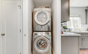 San Diego apartment for rent - A stack of two washing machines in a small room.
