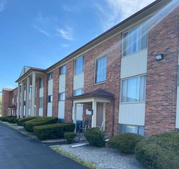Westland apartment for rent - A row of red brick apartment buildings with white trim and windows.