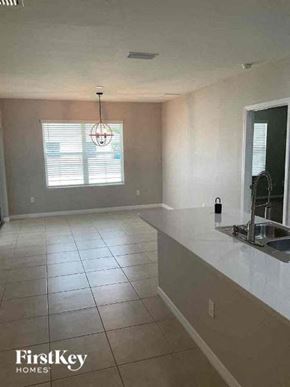 Cape Coral house for rent - an empty kitchen with a sink and a counter top