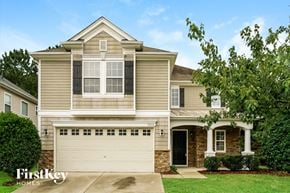 Raleigh house for rent - a tan house with a white garage door