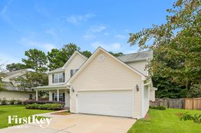 Moncks Corner house for rent - a white and with a yard and trees