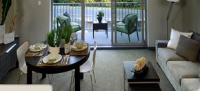 Nanaimo apartment for rent - A modern dining room with a glass door leading to a balcony.