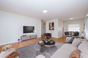 Oakland apartment for rent - A living room with a grey sofa and a grey rug.