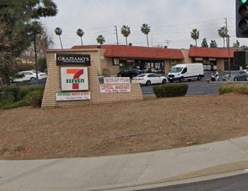 Yorba Linda apartment for rent - A 7-Eleven store is located in front of a building with a red roof.