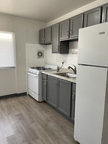 Jennings apartment for rent - a kitchen with a stove and a refrigerator