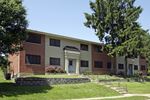 Jennings apartment for rent - a building with a lawn and trees in front of it