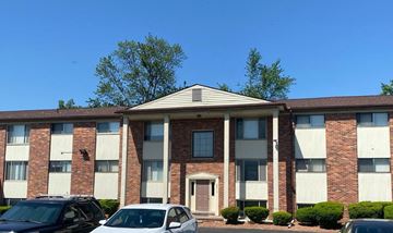 Westland apartment for rent - a brick building with cars parked in front of it