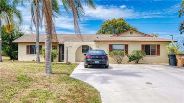 Cape Coral house for rent - A house with a car parked in front.