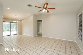 Cape Coral house for rent - A spacious room with a ceiling fan and tiled flooring.