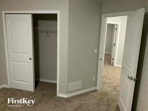 Colorado Springs house for rent - a bedroom with a closet and an open door