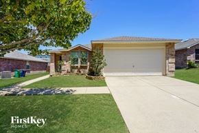 Mckinney house for rent - a house with a driveway and a garage door