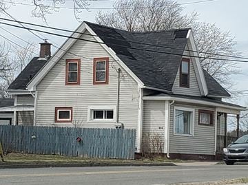 New Glasgow apartment for rent - a white house with a black roof and a fence